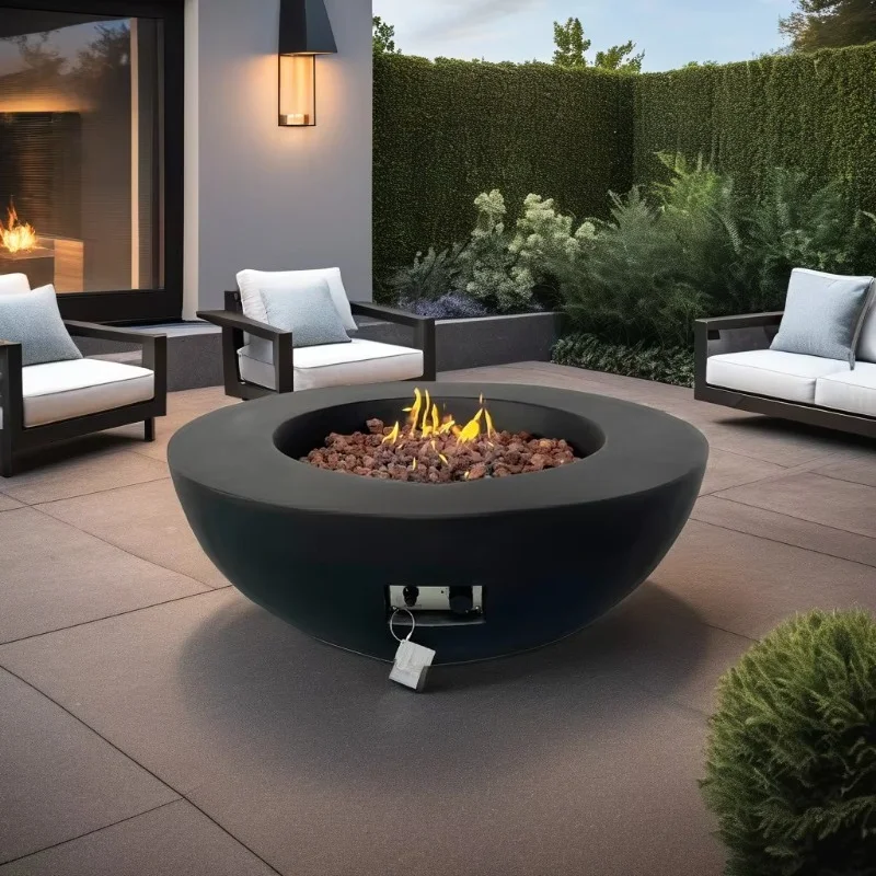 Modern outdoor round gas fire pit and brazier concrete with smooth surface and gas fuel heating