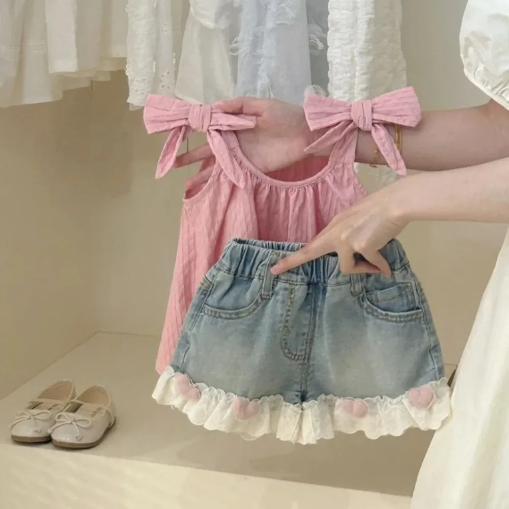 

Summer New Korean Version Sweet Girl Casual Suit Pink Bow Camisole Vest+denim Pocket Shorts Two-piece Set with Heart Decoration