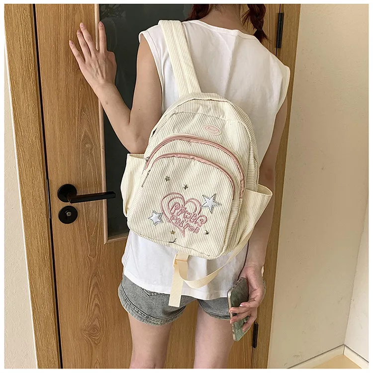 This simple embossed corduroy backpack for girls is cute, unique and versatile for commuting