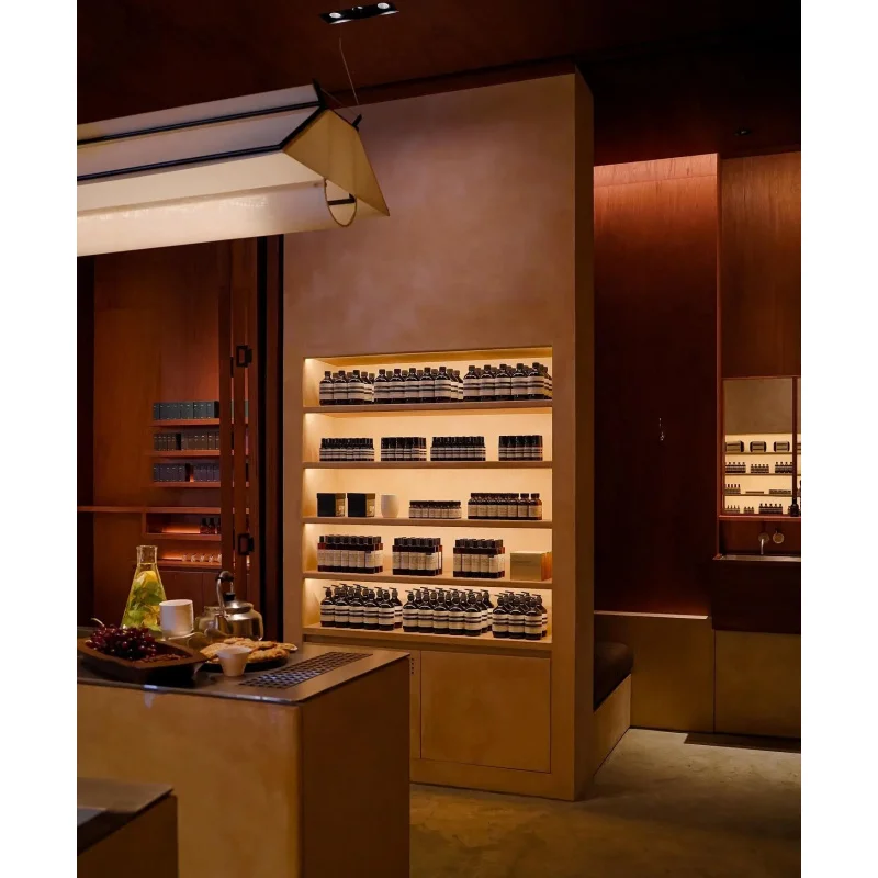 custom.High-End Custom Cosmetic Display Stand with LED Lighting Mirror and Light Box Makeup Shop Interior Design