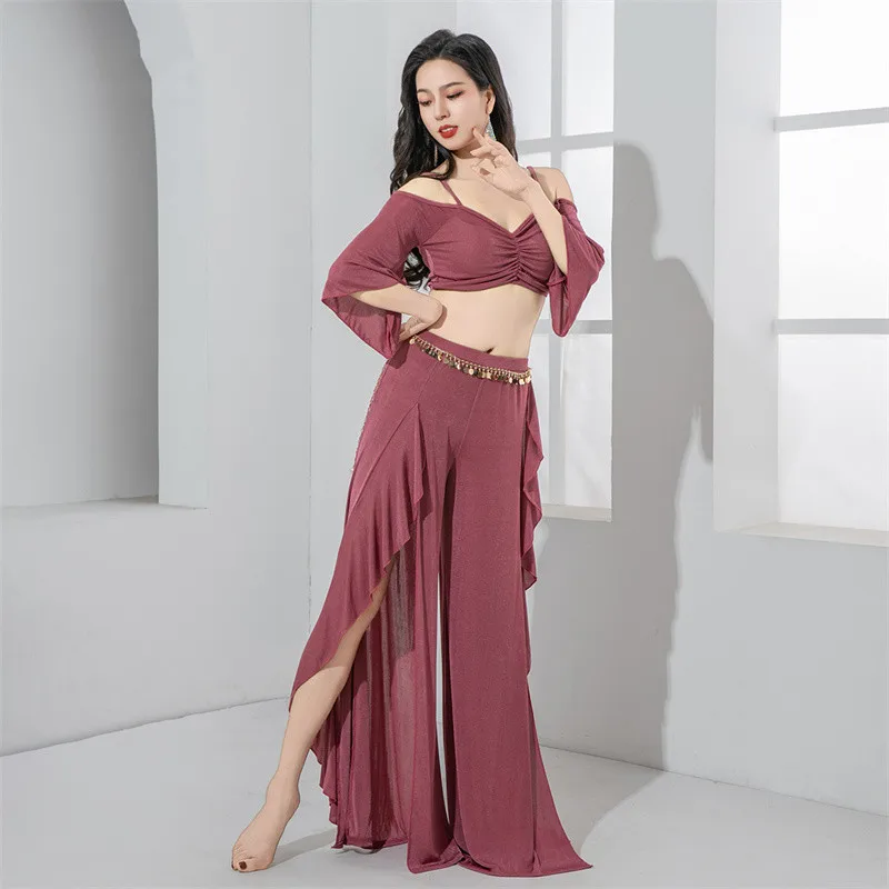 2025 Vestito da danza del ventre da donna Costume da spettacolo teatrale Manica lunga con volant Gonna con spacco laterale Pantaloni a vita alta Cintura da spettacolo per ballerini di squadra