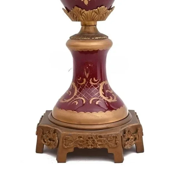 Antique brass and porcelain adorned vase with ornate details of Burgundy floral paintings