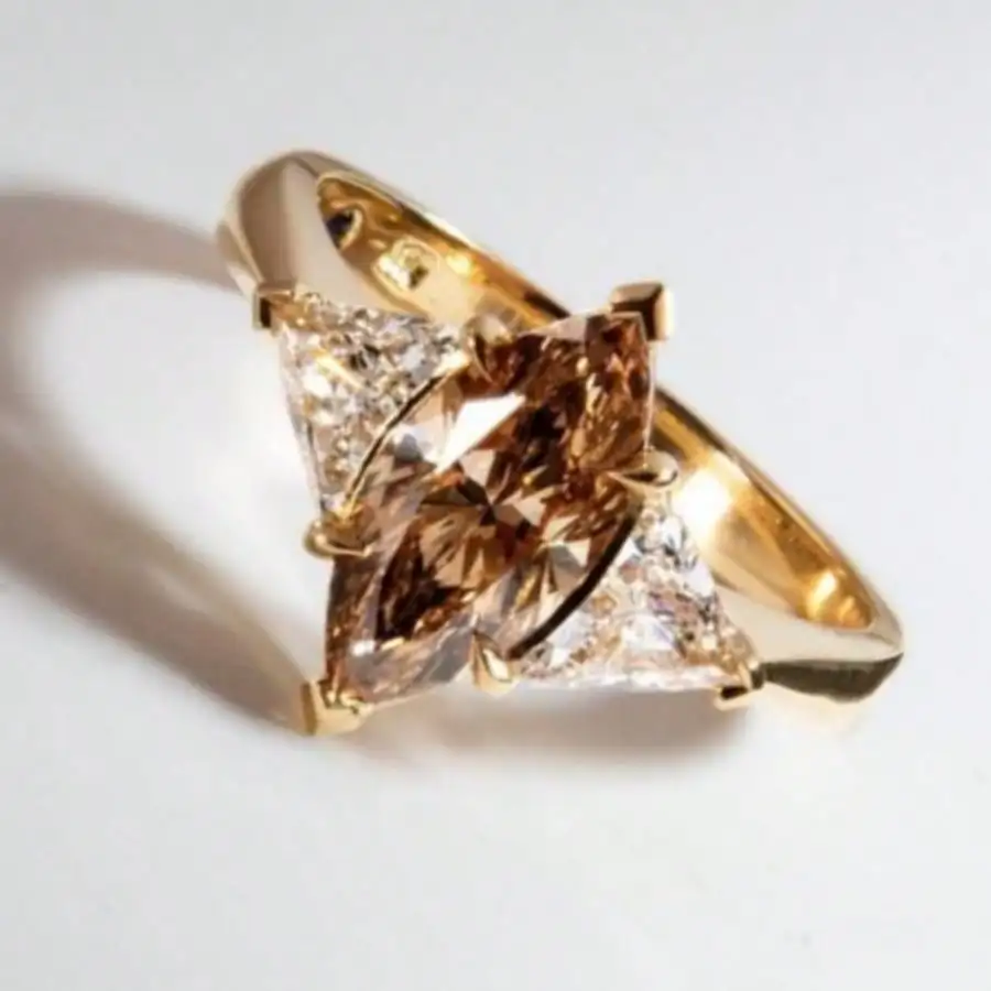

Gold-Tone Ring with Champagne & Clear Triangular Simulated Zirconia Stones