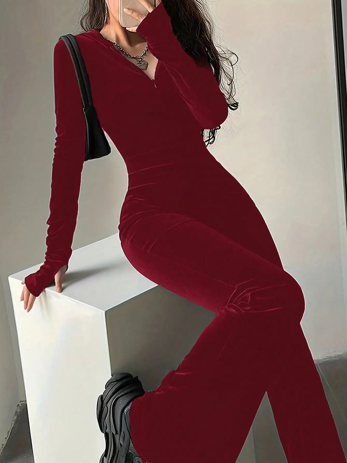 Elegant Burgundy Long-Sleeve Hooded Bodycon Jumpsuit. S8ae9bdfd85844ea1853d80f0ae2df665e