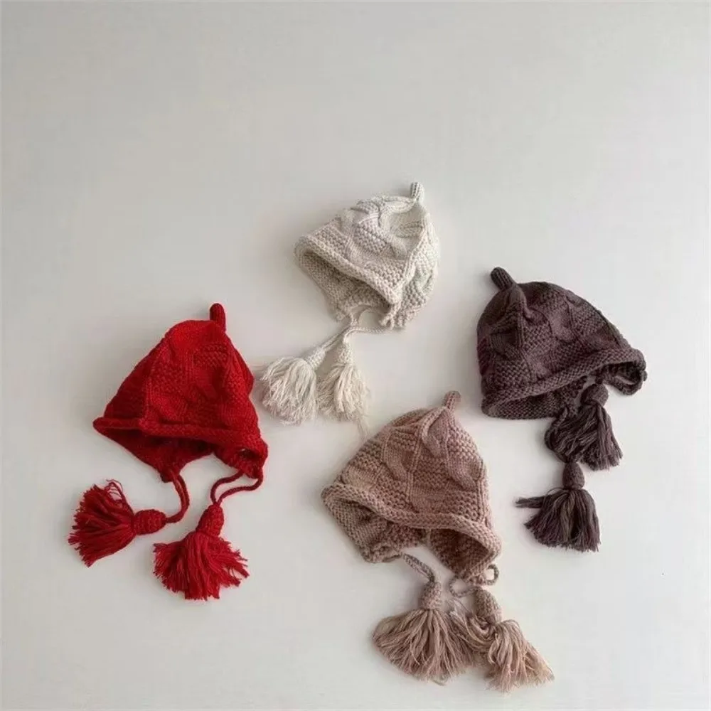 

New Windproof Knitted Wool Hat Tassel Lace-Up Design Ear Protection Cap Pullover Hat 3-9 Years