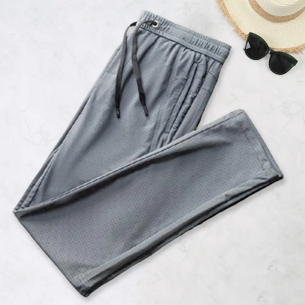 

Men Sport Pants Solid Color Breathable Deep Crotch Loose Drawstring Ankle-banded Zipper Pockets Mesh Men Sweatpants Male Clothes