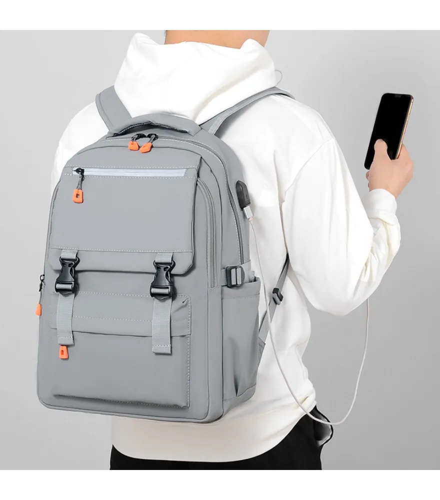Gray workwear style backpack with orange accent details built in side USB port multiple buckle pockets reflective strip water