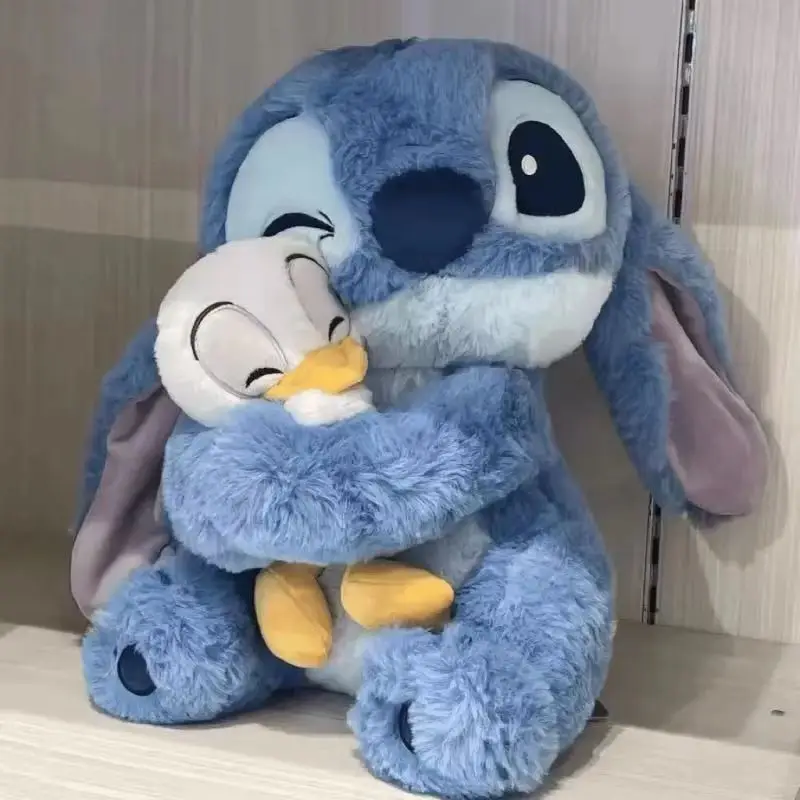 2025New Disney 20cm muñeco de peluche Stitch Lilo muñeca lindo pato Stitch peluche juguete Navidad regalo de cumpleaños para niños juguete Kawaii