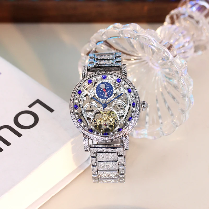 

A men's silver steel band vintage-style automatic mechanical watch with exquisite sun and moon relief design