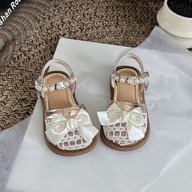 

Kids Princess Shoes with Ribbon Bows Girls Beach Shoes Mesh Breathable 2026 Summer New Children Sandals Soft Bottom Non-slip