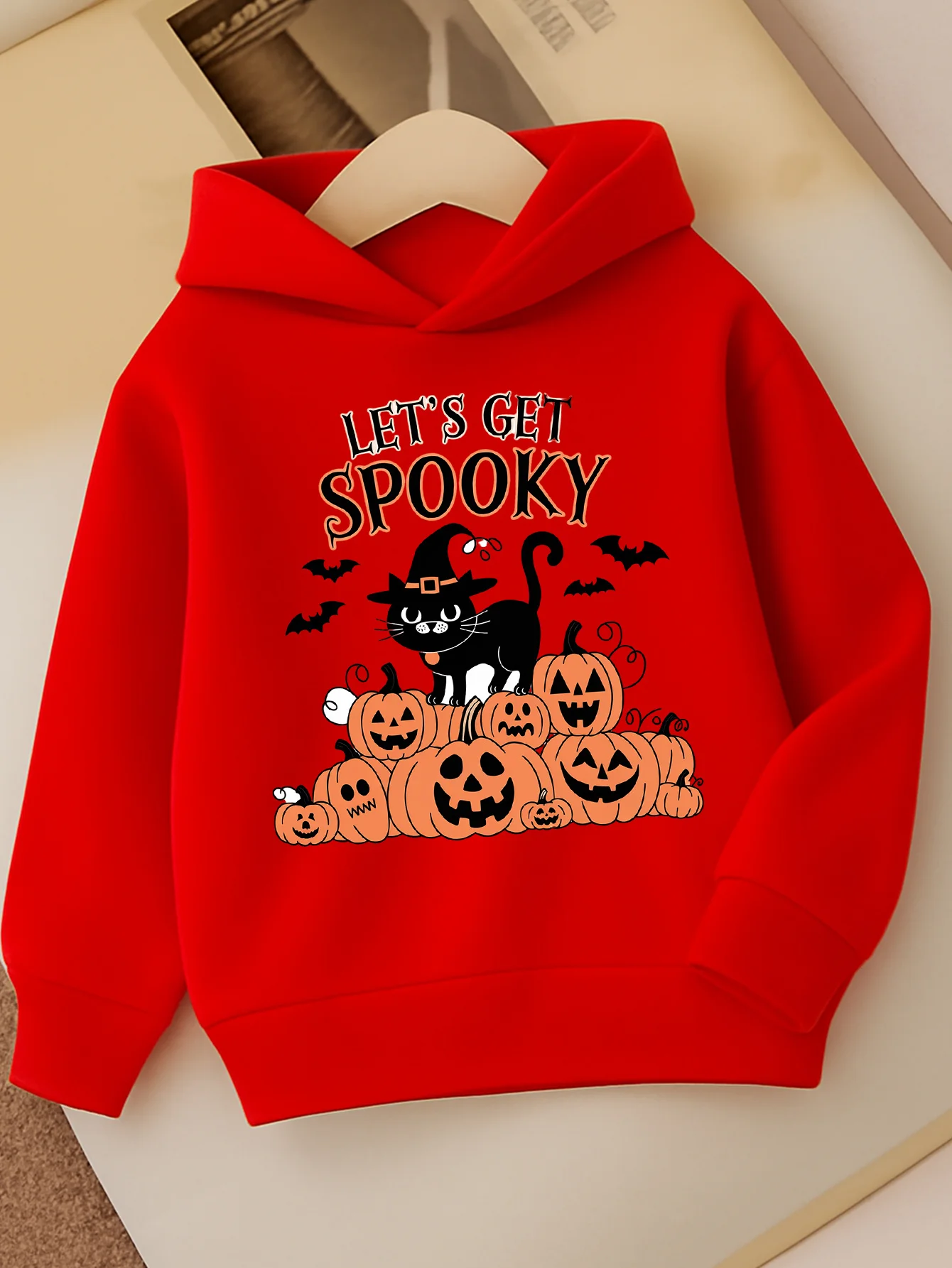Red hooded sweatshirt for girls Halloween-themed sweaterwith blackcat bat and pumpkin lantern print,perfect for fall and winter.