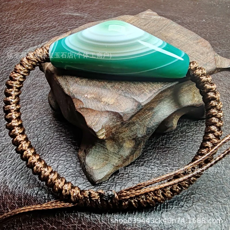 Braided bracelet made of Sardonyx Dzi beads with natural shapes and high oil content