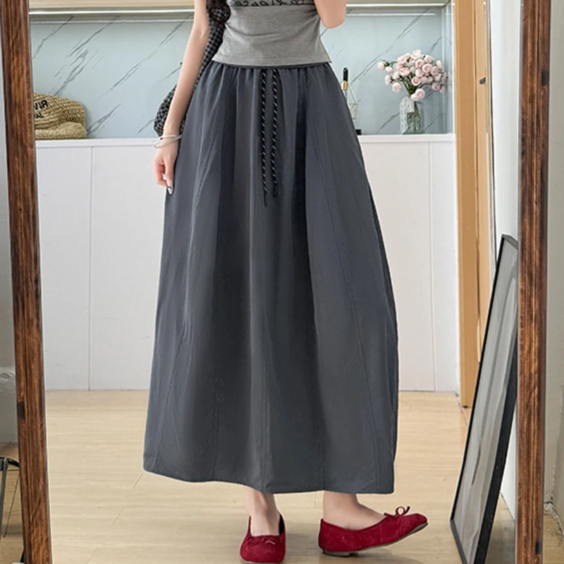 تنورة نسائية صيفية من الحرير الجليدي لعام 2025 بخصر مطاطي كوري تنانير طويلة على شكل حرف A للسيدات بأربطة ملابس خروج رفيعة تنانير نسائية