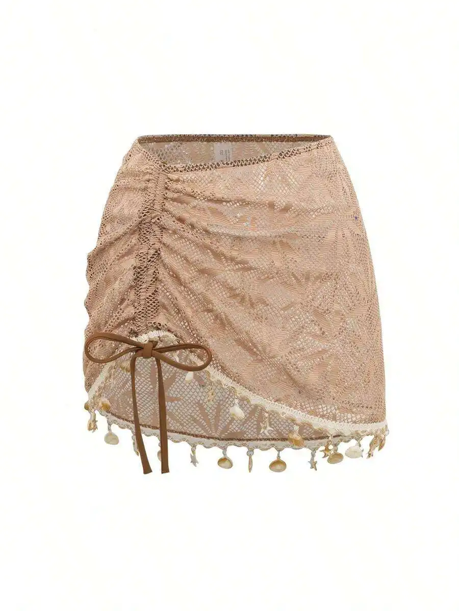 

Lace Wrap Mini Skirt With Ruched Detail, Front Tie Bow, And Shell Tassel Trim
