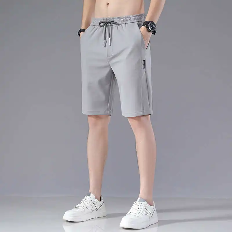 

Men's Ice Silk orts Summer 2025 New Korean Loose Elastic Splicing Beach Five-Quarter Casual Pants High Waist Straight Leg