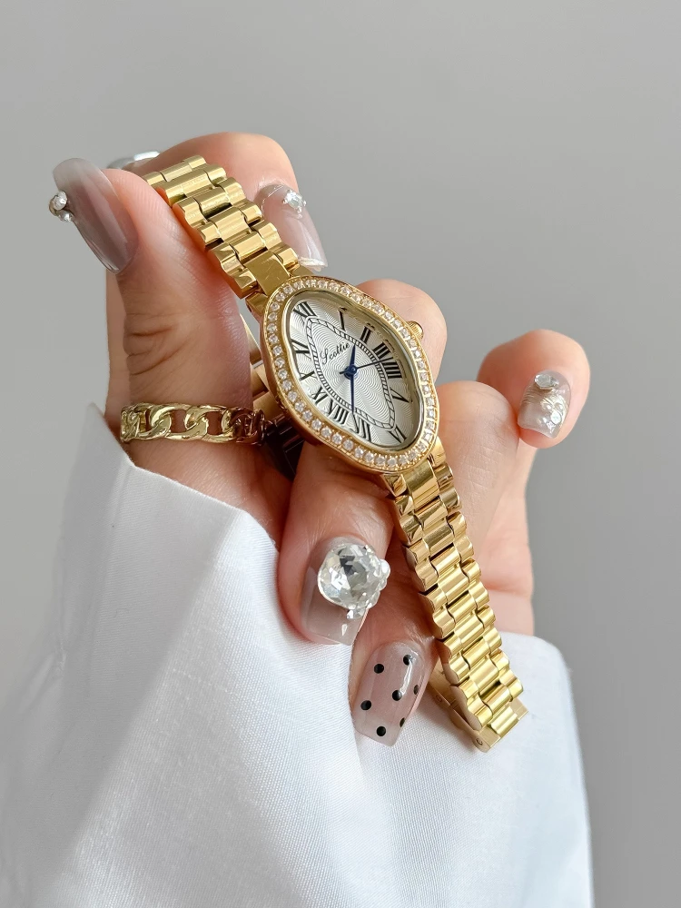 

Элегантные женские часы с золотыми римскими цифрами, нежный циферблат, женские часы из нержавеющей стали, роскошный браслет, подарочные часы для женщин
