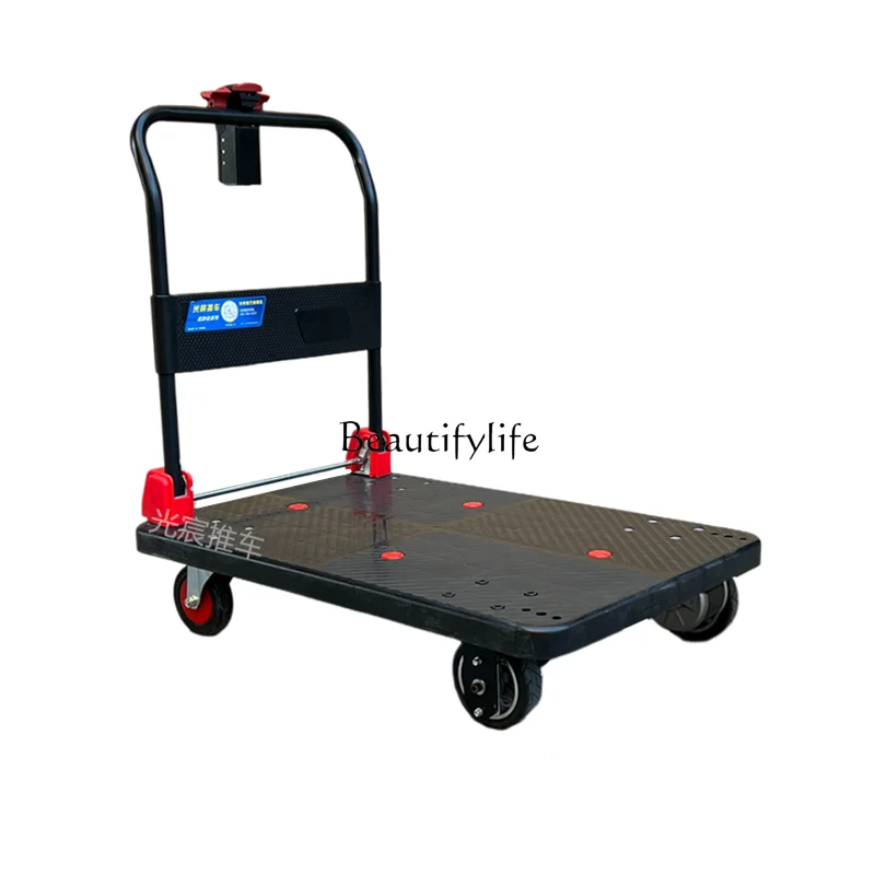

Electric flatbed cart trolley pulling goods small into the elevator trolley