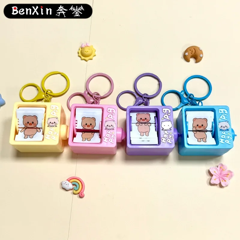 

2025 miniso exquisite and high-end children's educational toys, little pig flipping animation machine, keychain pendant