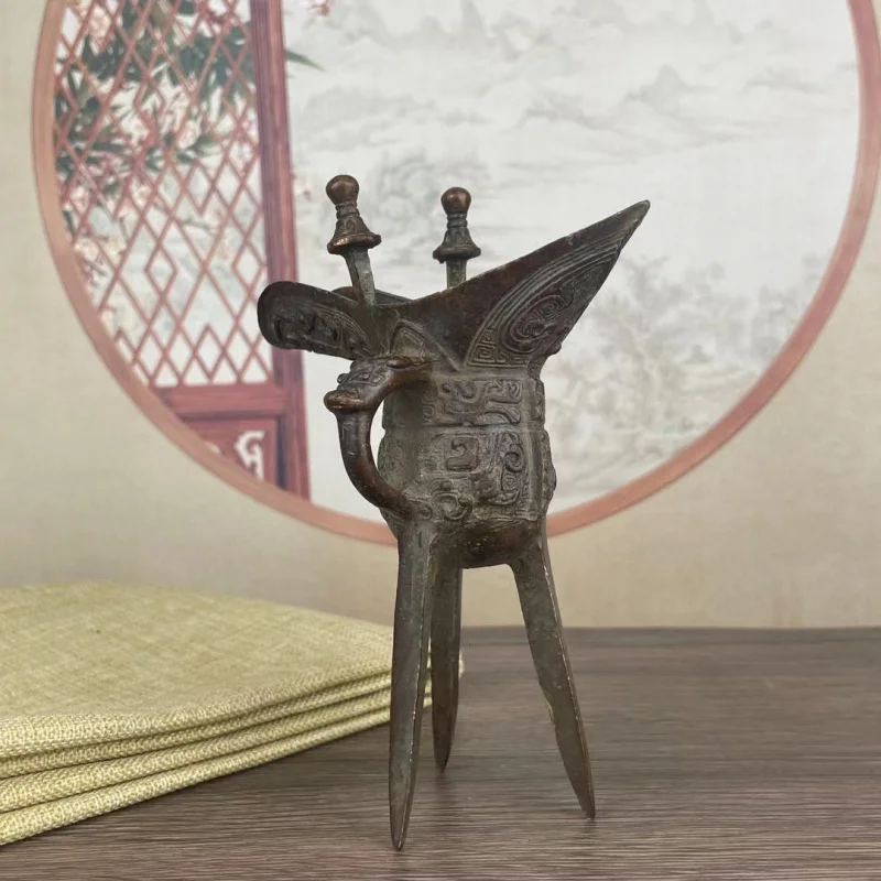 Bronze three-legged , Fu Xin's wine cup, office desk ornament, home decoration, Xuan Niao beast face pattern