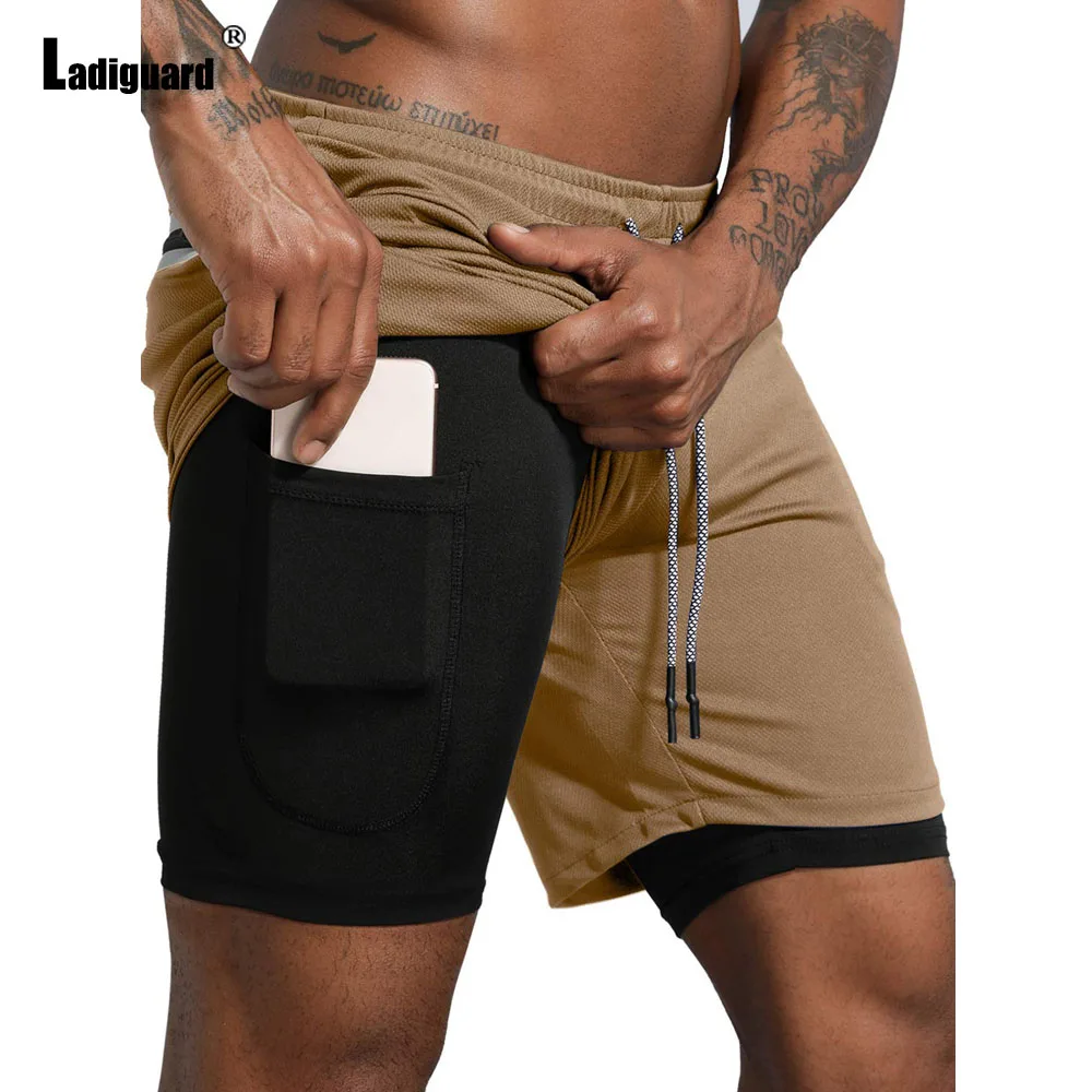 2025 Pantaloncini da corsa sportivi casual con tasca alla coreana da uomo Nuovi pantaloncini da spiaggia estivi Pantaloni corti da fitness da uomo Abbigliamento da uomo sexy Taglie forti