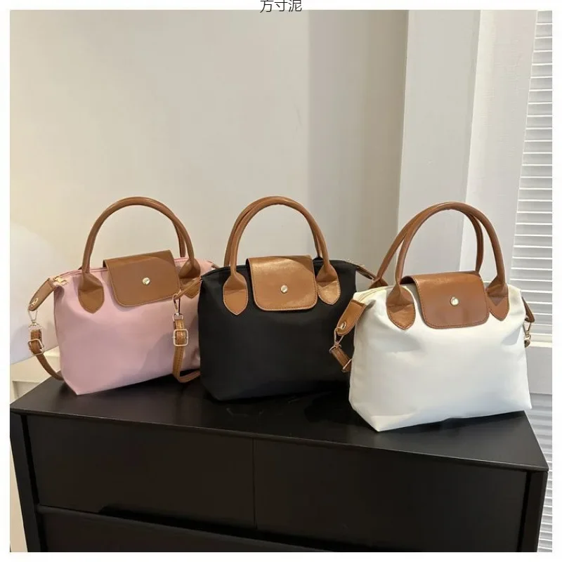 

Autumn and Winter Crossbody Commuting Large Capacity Oxford Cloth Canvas Bag Women 2025 New Dumpling Bag Handheld Crossbody Bag
