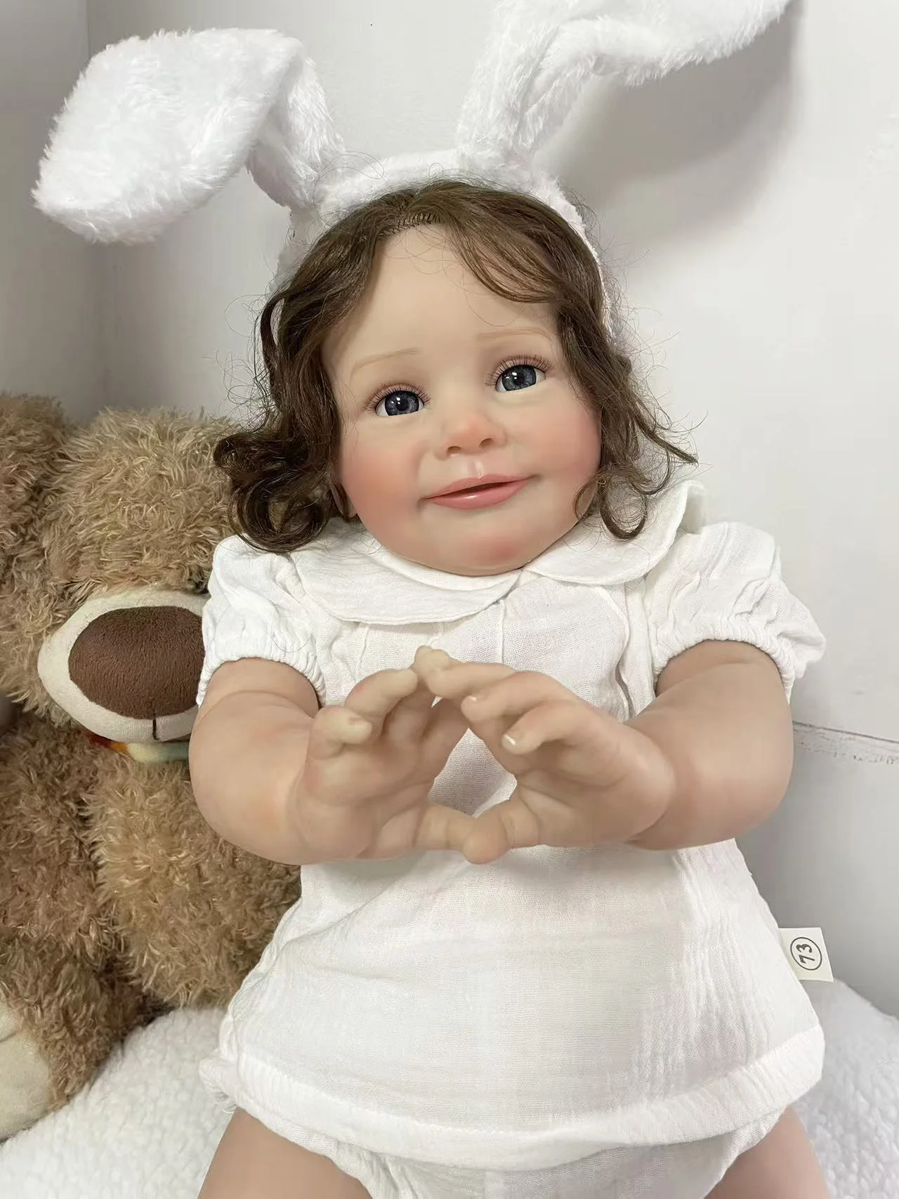 25Inch Wearing a white short sleeved clothing set and white rabbit ear headband Lifelike Cute Zoe Reborn Doll Hand Root Hair