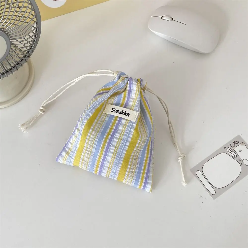 Sac de changement de mode, sac de rangement à cordon de serrage à rayures, porte-monnaie, sac d'emballage, sac de maquillage, petit sac de rangement en toile, sac de cosmétiques pour filles