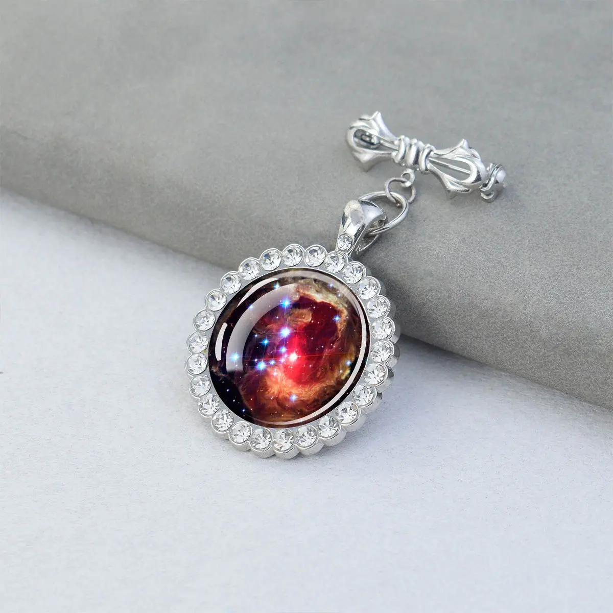 1PC Nebula and galaxy patterned circular glass brooch with synthetic zircon trim, suitable for holiday party gifts.