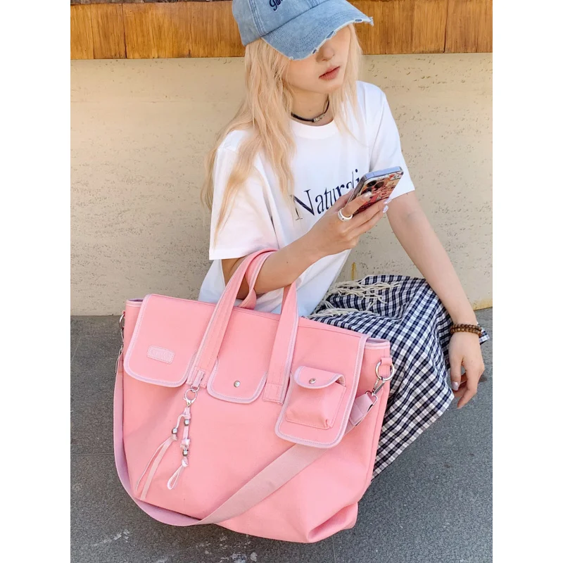 

Niche large-capacity canvas bag for female college students2026New casual shoulder crossbody bag for class and commuting tote ba