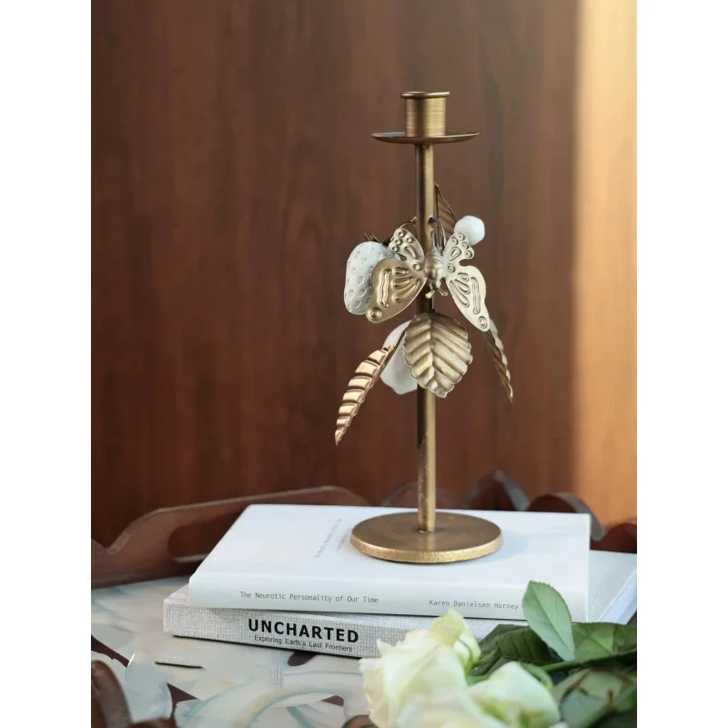 Metal ironwork candlestick, high luxuriou decorative piece live room di table surface, candle with antique butterfly decoration.