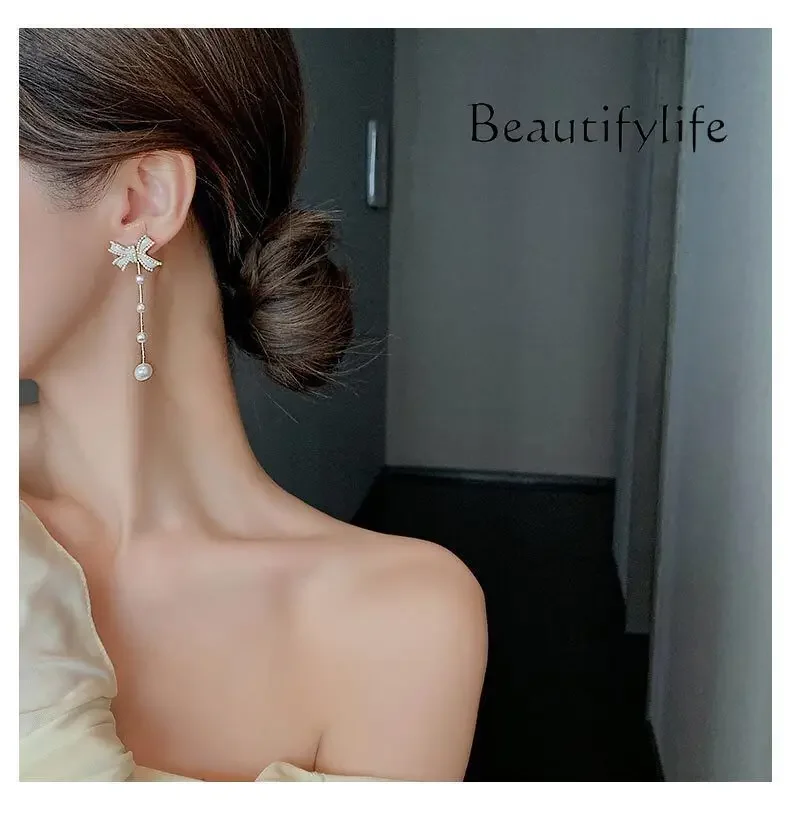 Exquisite light luxury bow earrings, new thin temperament, long pearl earrings, high-end sense