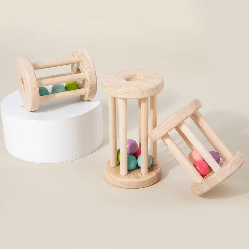 Wooden rattle toy with colorful balls and metal bells in various combinations—perfect for babies to grasp and shake for endless