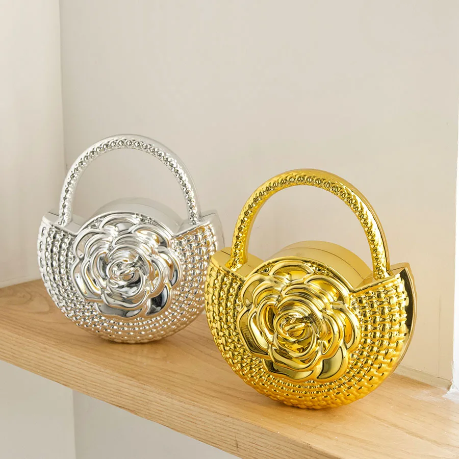 Light luxury metal hand bag, three-dimensional camellia relief delicate texture, gorgeous and exquisite dinner bag