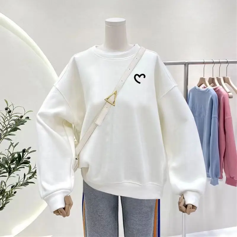 "His & Hers K-Style Tees. Unique prints, soft fleece, and an effortless oversized fit for couples."