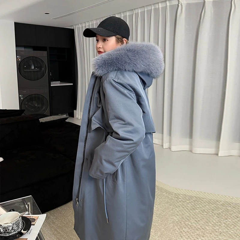 Le nouveau manteau d'hiver en fourrure semblable à du renard, veste mi-longue avec Parka détachable de Pai Pai est à la mode et au chaud pour les femmes