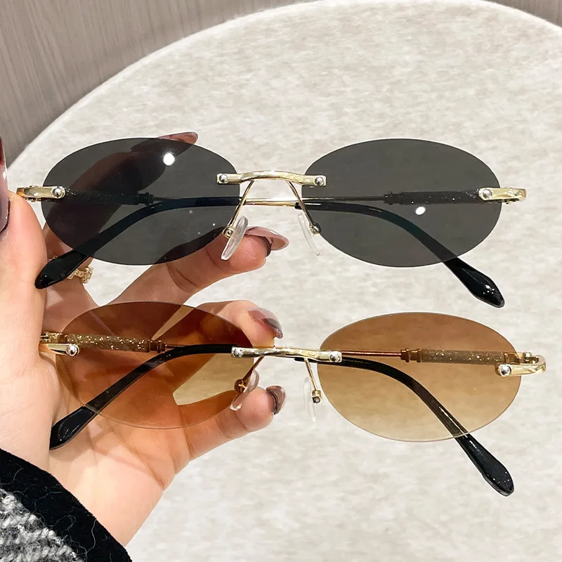 

Женские солнцезащитные очки в овальной оправе, новые индивидуальные очки без оправы с обрезанными краями, модный дизайн, очки в маленькой оправе