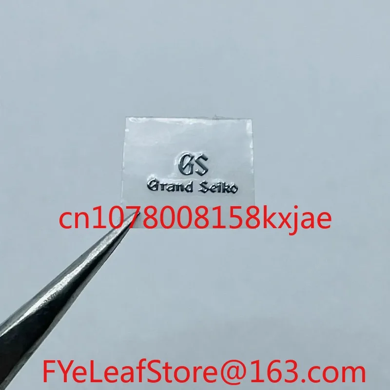 شاهد ترصيع الشعار الحرفي، وملصقات الشعار المعدنية، وملصقات الملصقات على شكل حرف S