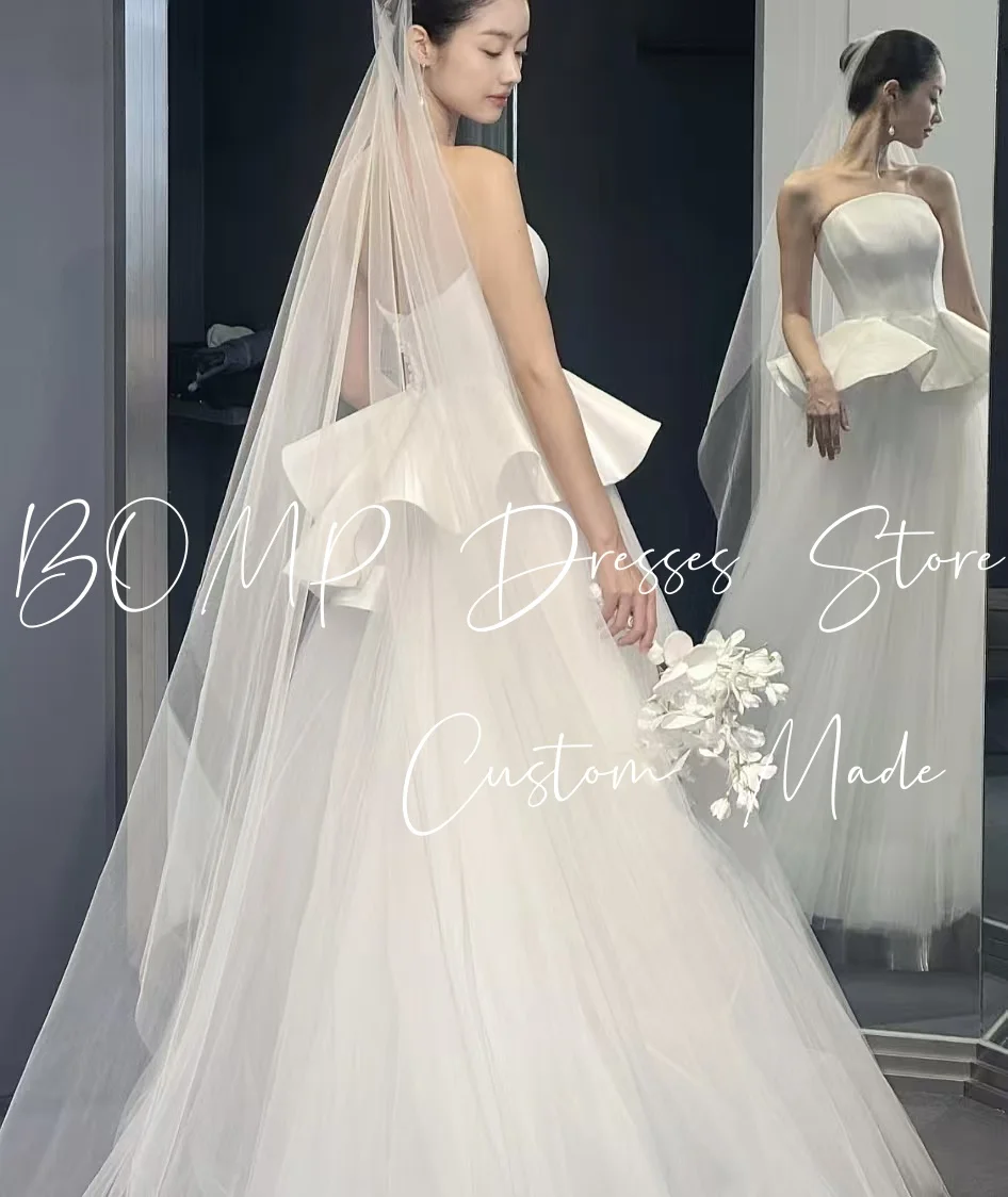 ชุดแต่งงานหรูหราแบบเกาะอกทรงคอร์เซ็ทผ้าทูลล์สีไอวอรี่ยาวกรอมพื้นสไตล์เกาหลีสำหรับถ่ายภาพงานแต่งงานและงานเลี้ยงต้อนรับ  รับตัดตามแบบ