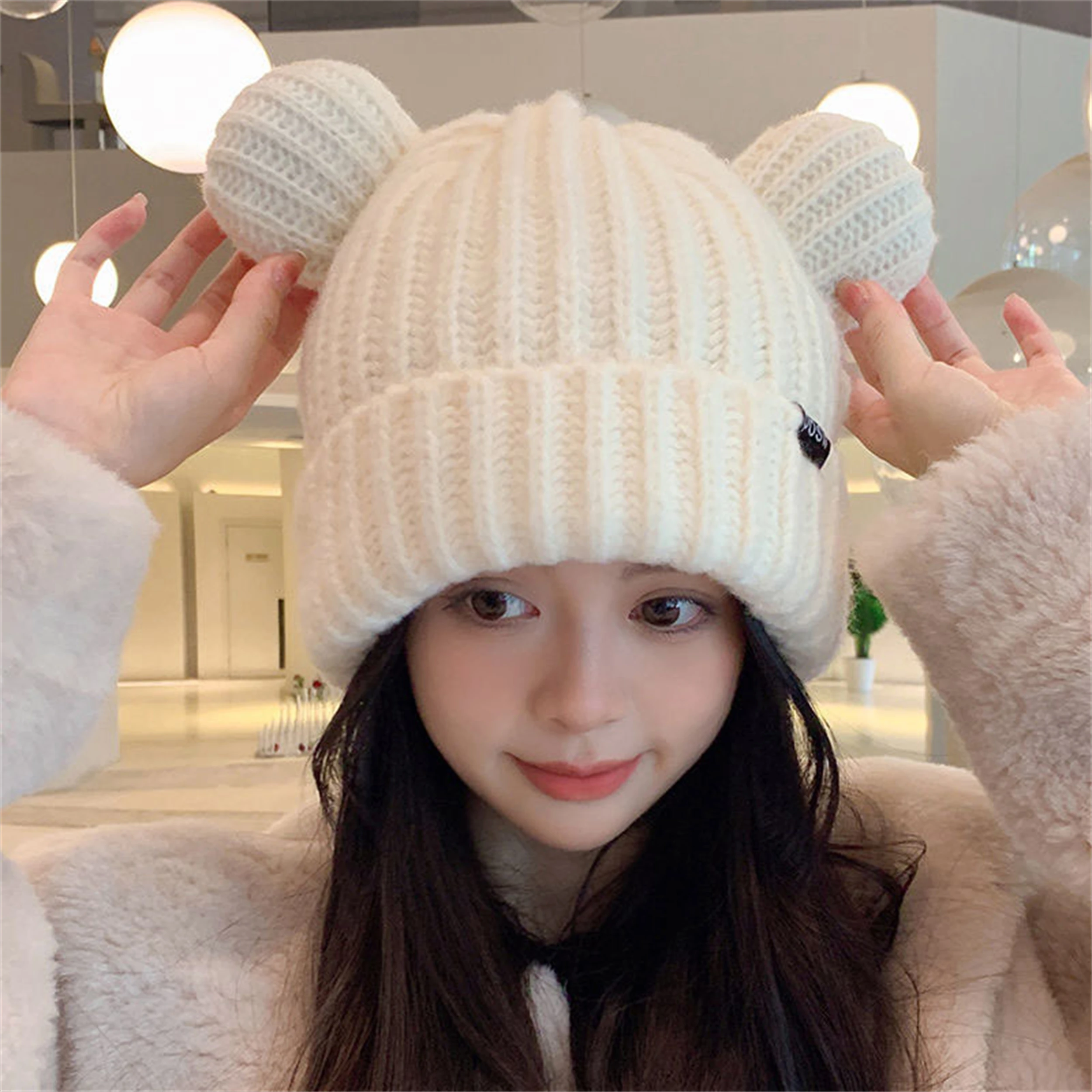 

Cute teddy bear keeps warm and shows off face, small knitted hat for cold protection, ear protection, and headband sweater hat