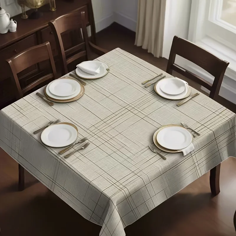 The square tablecloth has a light beige base and brown lines interwoven to form a checkered pattern.