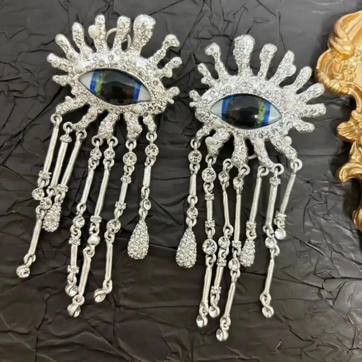 

Schiaparel style Devil's Eye tassel earrings, vintage French face art, old money