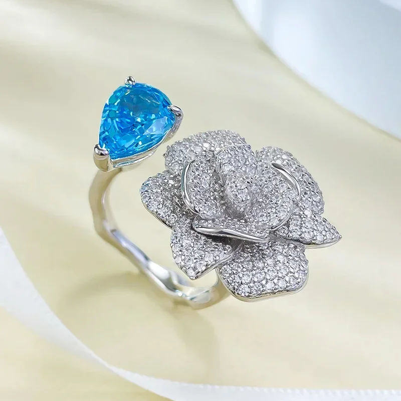 

NewSpring New Camellia Ring 925 Silver Inlaid 7 * 10 Sea Blue Ice Flower Cut Ring Wedding Jewelry