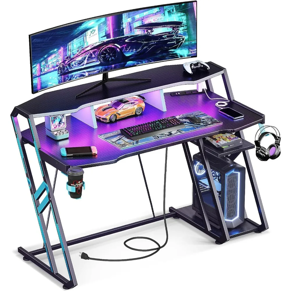 

Gaming Desk with Power Outlet & LED Lights, Computer Desk 47inch with PC Storage Shelf, Gaming Table with Carbon Fiber Texture,