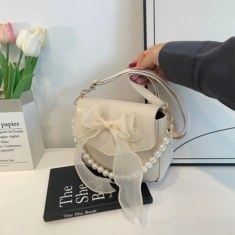 حقيبة كتف السيدات السوداء الكورية القوس عقدة قمة الموضة مقبض حقيبة المرأة قماش كبير الإبط حقيبة 2025 مصمم حقائب اليد الجديدة bolsas