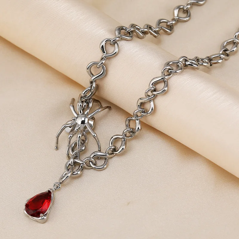 

The new titanium steel spider ruby pendant necklace is a niche design accessory for women, featuring a simple bone chain