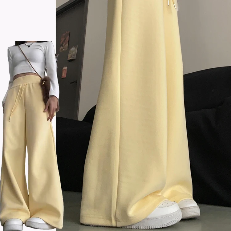 กางเกงฮาเร็มลำลองสีเหลืองนมสำหรับผู้หญิง ฤดูใบไม้ผลิ-ฤดูร้อน 2025 รุ่นใหม่ ช่วยลดเลือนริ้วรอย ทรงหลวมพลิ้ว ช่วยให้ดูผอมเพรียว ทรงกระดิ่ง แฟชั่นเกาหลี...