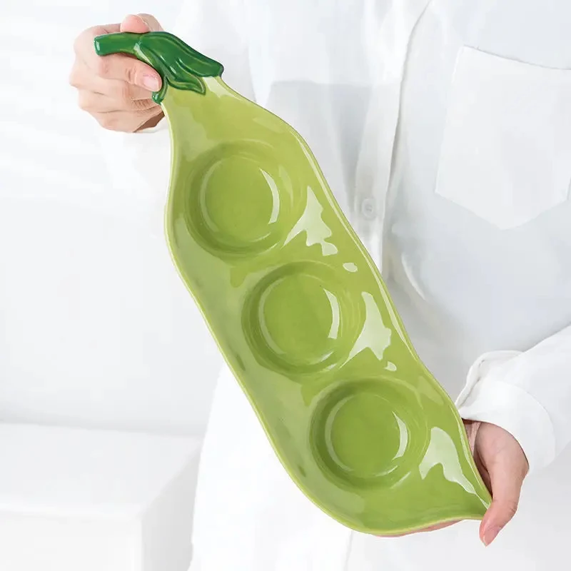 

Креативная керамическая длинная тарелка в форме стручка гороха, подглазурное цветное украшение, боковое блюдо с орехами, тарелка Dim Sum, бытовая посуда для ресторана