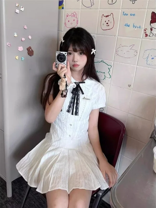 Letnia, słodka, herbaciana przerwa na herbatę, wyszczuplająca talia, kołnierzyk ort Dr, damska biała spódnica w kształcie litery A, pojedynczy element.