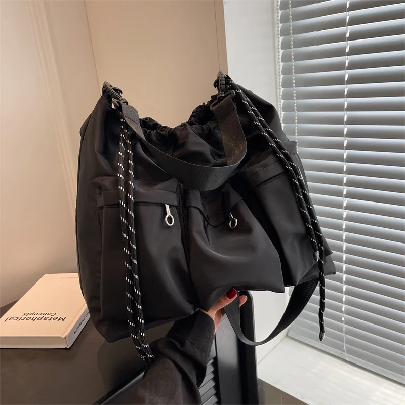 

Y2K Drawstring Crossbody Bag for Women Men Messenger Bag Causal Handbags Black Book Bag Street Oxford Cloth Leisure Shoulder Bag