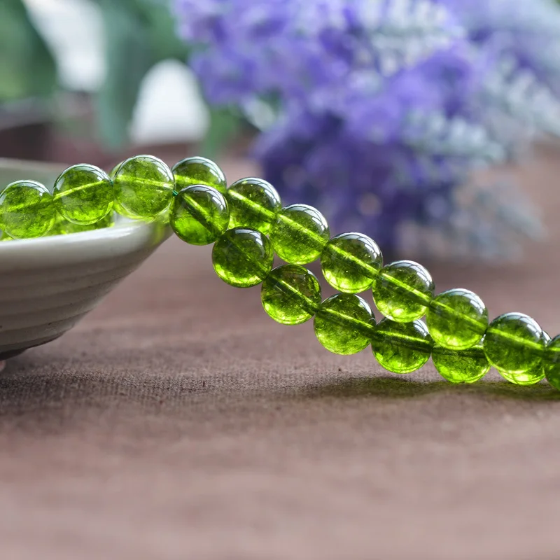 

Grade AA Natural Clear Quartz Beads Grass-green Dyed into Peridot Color 6mm-12mm Smooth Polished Round 15 Inch Strand CQ21